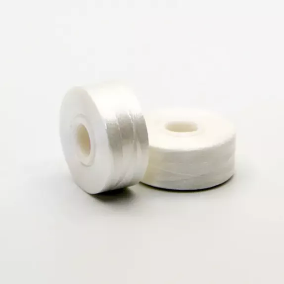 Onde as perdas ocultas nas fábricas de bordados resultam de linhas de bobina de qualidade inferior?